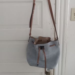 Michaela Kors baby blue Suede cross body purse